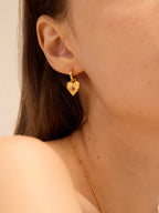 Gold hammered heart earrings with square ruby and starburst rays — Winding Moonlight