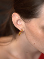 Gold sculptural C-shape portrait earrings with fluid curves — Winding Moonlight