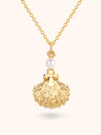 Gold scallop seashell locket necklace opening to reveal a freshwater pearl — Winding Moonlight