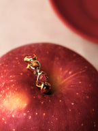 Gold heartbeat ring with alternating tiger's eye and red agate hearts — Winding Moonlight