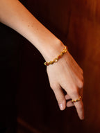 Valor multi-gem bracelet with tiger's eye and red agate beads on wrist — Winding Moonlight