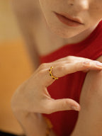 Gold heartbeat ring with alternating tiger's eye and red agate hearts — Winding Moonlight