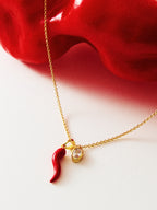 Gold chili pepper pendant necklace with red enamel and zircon-set oval — Winding Moonlight