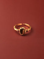 Gold flame ring with tiger's eye cabochon and red agate accents on hammered band — Winding Moonlight