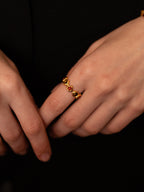 Gold heartbeat ring with alternating tiger's eye and red agate hearts — Winding Moonlight