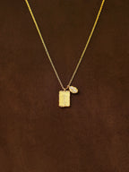 Gold coffee bean necklace with Amor bar pendant and zircon details — Winding Moonlight