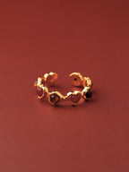 Gold heartbeat ring with alternating tiger's eye and red agate hearts — Winding Moonlight