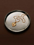 Gold hammered heart necklace with square ruby centre — Winding Moonlight