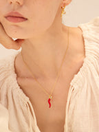 Gold chili pepper pendant necklace with red enamel and zircon-set oval — Winding Moonlight