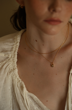 Dainty gold lock pendant necklace with sparkling zircon centre — Winding Moonlight
