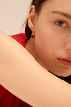 Gold frame earrings with carnelian cabochon and hammered texture — Winding Moonlight