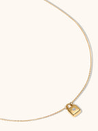 Dainty gold lock pendant necklace with sparkling zircon centre — Winding Moonlight