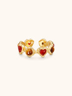 Gold heartbeat ring with alternating tiger's eye and red agate hearts — Winding Moonlight